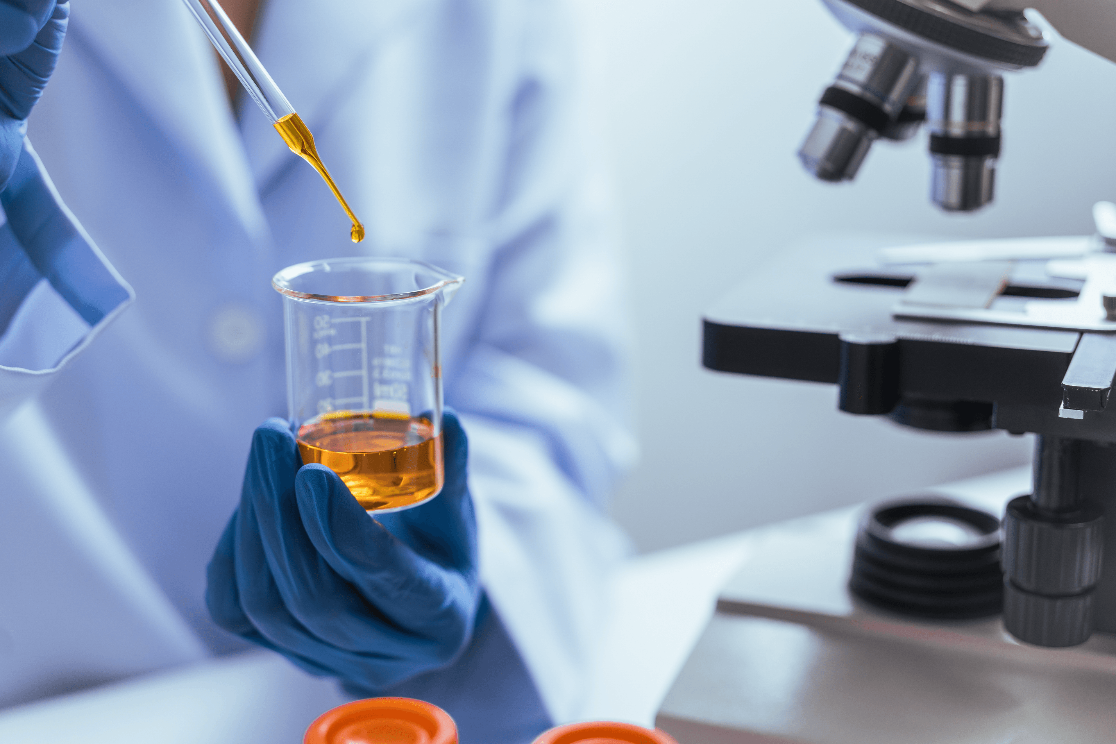 Lab technician testing oil quality